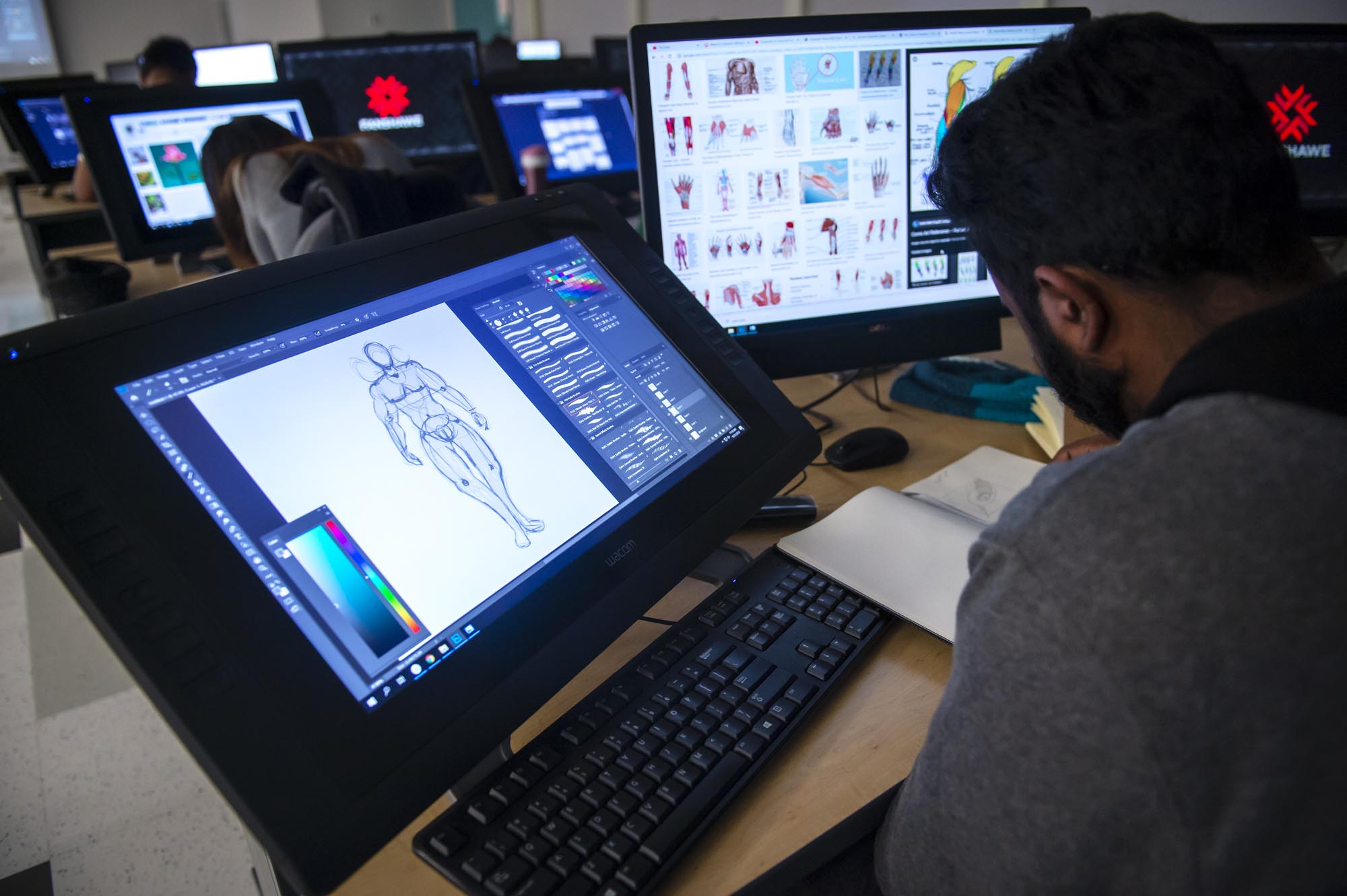  3D Animation and Character Design student working in computer lab