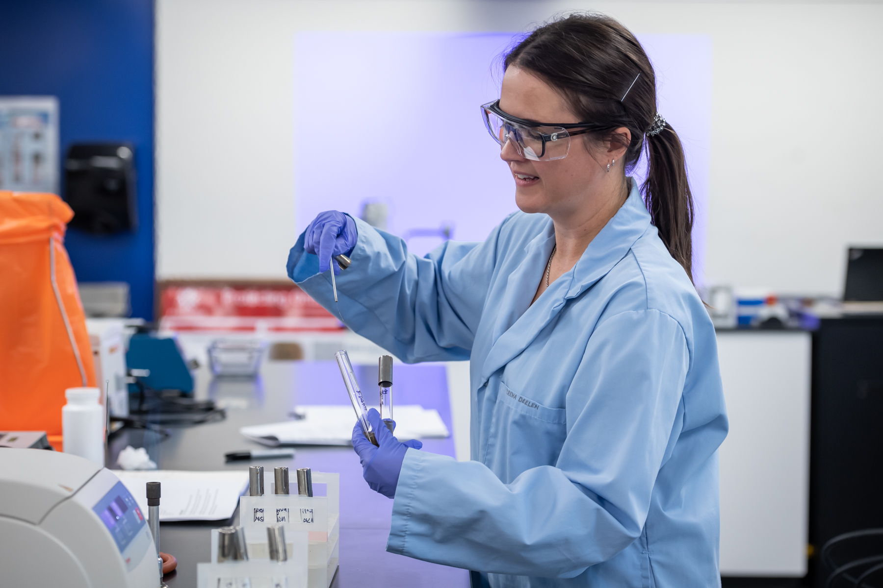 Biotechnology student working in a science lab environment.