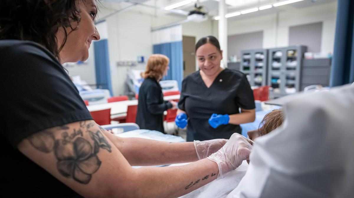 two nurses administer patient treatment