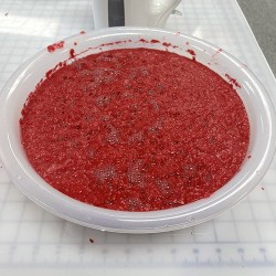 red paper pulp in a bowl